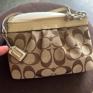 Coach like new, gold trim pouch wristlet
